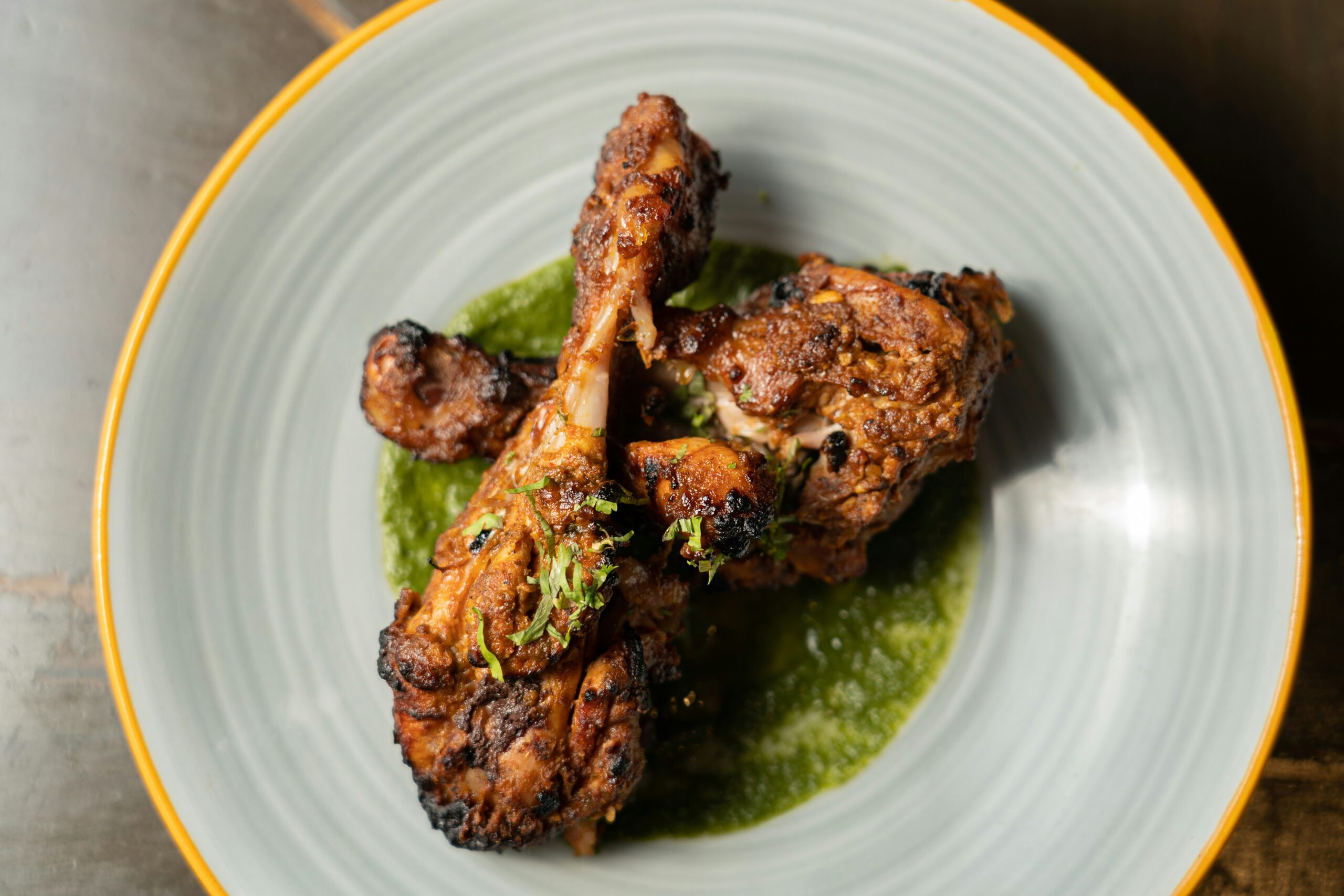 Grilled variation of crack chicken served with herbs, representing tips and variations for the recipe